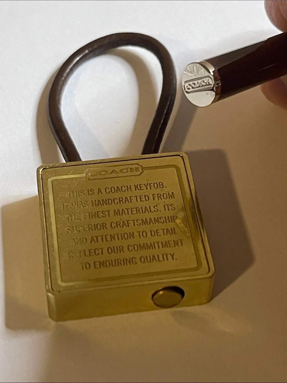 Coach Gold-Tone Brass Key Fob with Brown Leather Loop and Coach Pen
